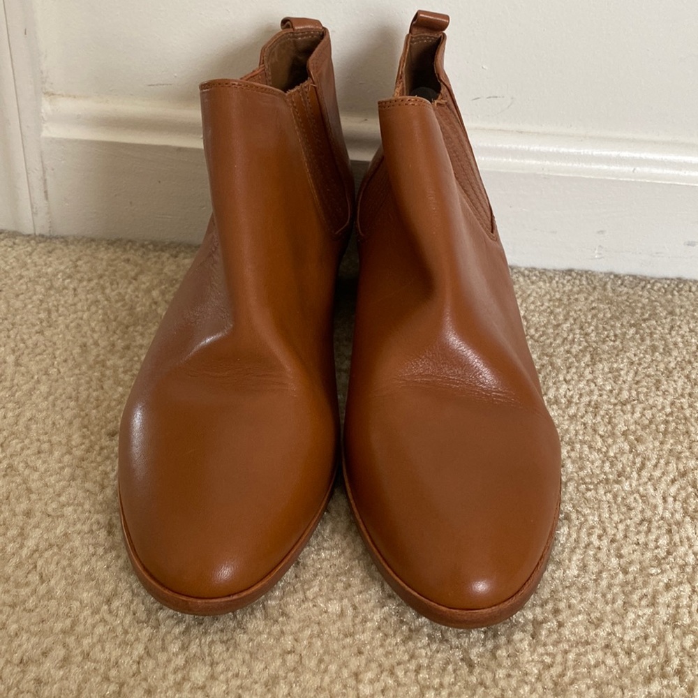 Brown leather Micheal kors mini boots with slight heels.  Brand new, size 7.5